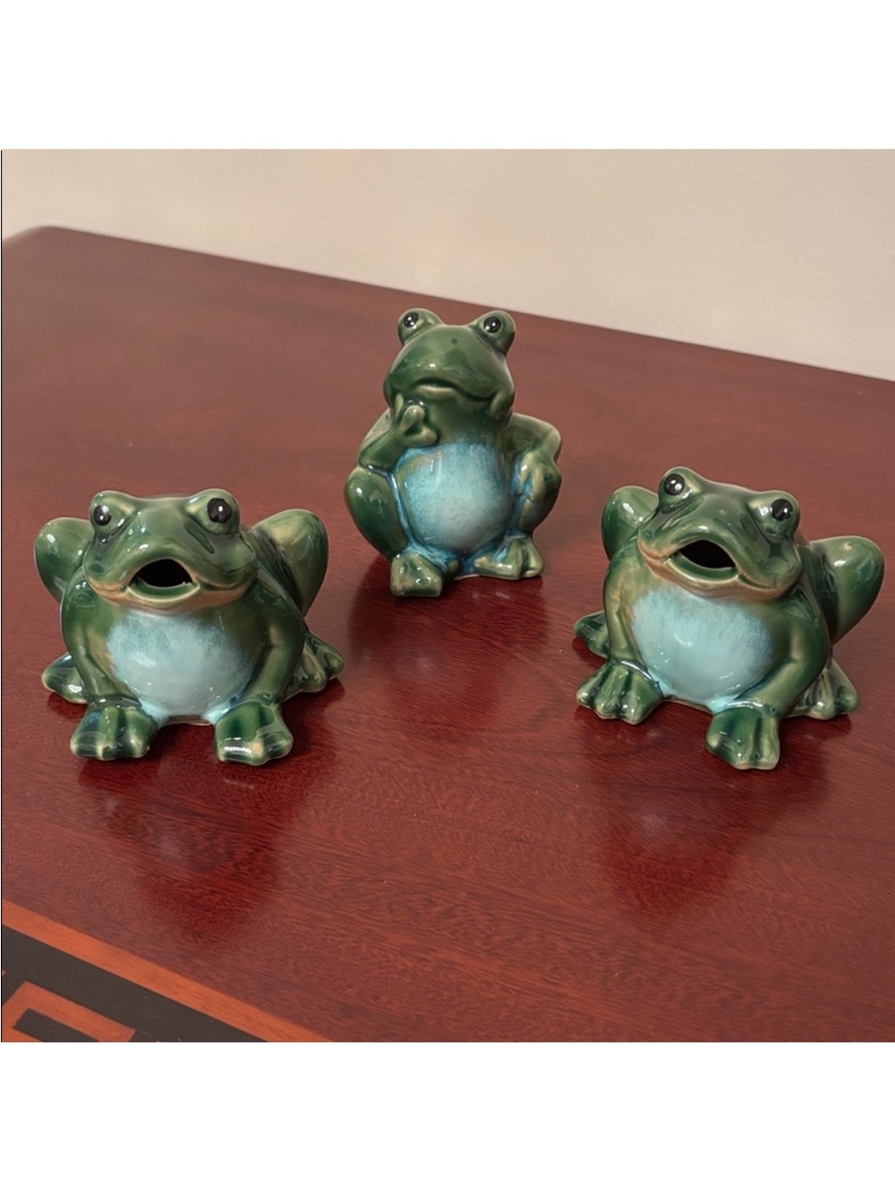 Set of three smooth ceramic green frog figurines